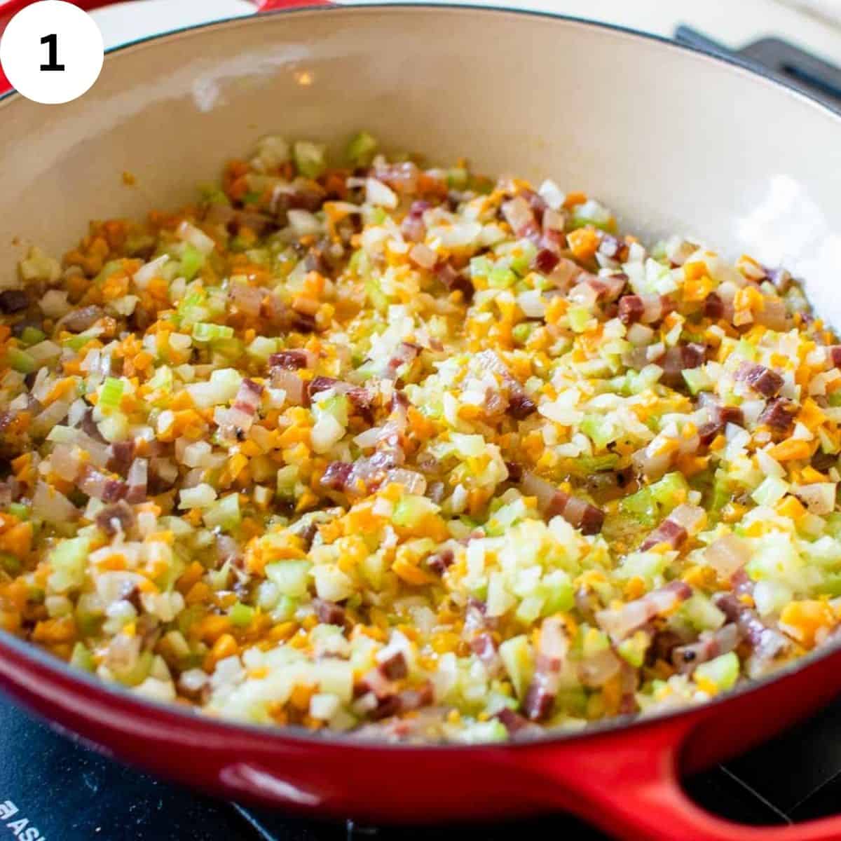 Soffritto of vegetables in a round pan.