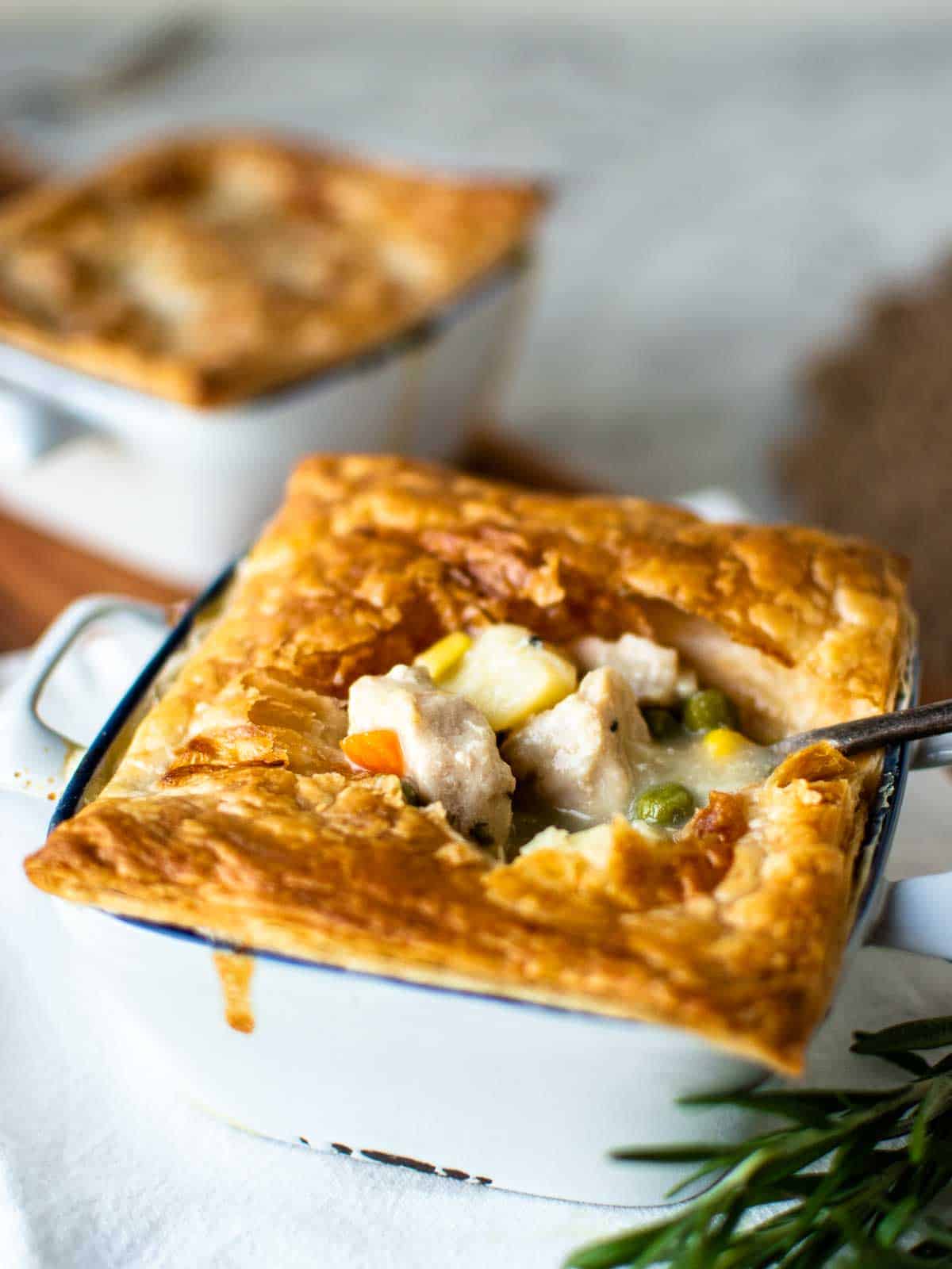 An instant pot chicken pot pie cut open and served with a spoon. 