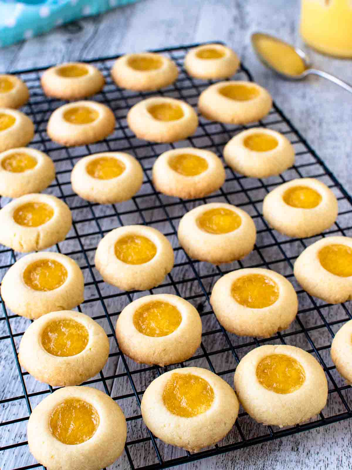 Rows of Lemon Curd Cookies on a black wire rack.