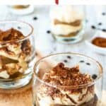 Tiramisu cups on wooden board.