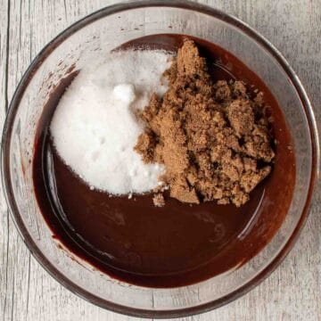 Brown and white sugar on melted chocolate mixture.