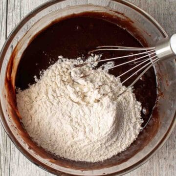 Flour added on top of melted chocolate mixture.