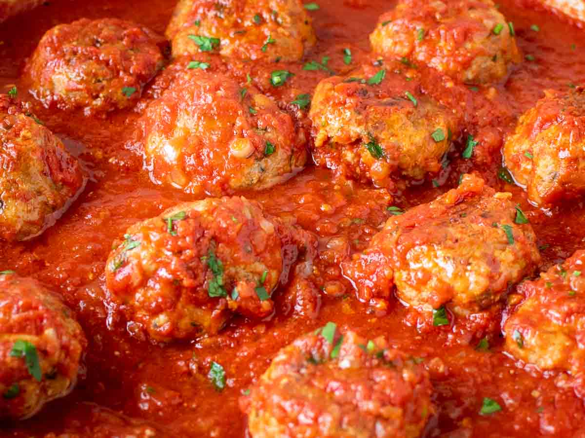 Close up of meatballs in tomato sauce.