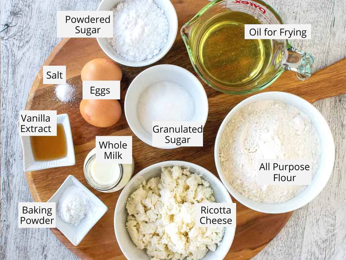 Ingredients for these ricotta donuts viewed from above.