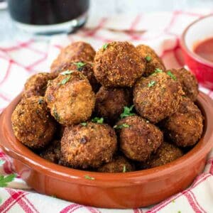 Fried Meatballs piled into a shallow terracotta bowl.