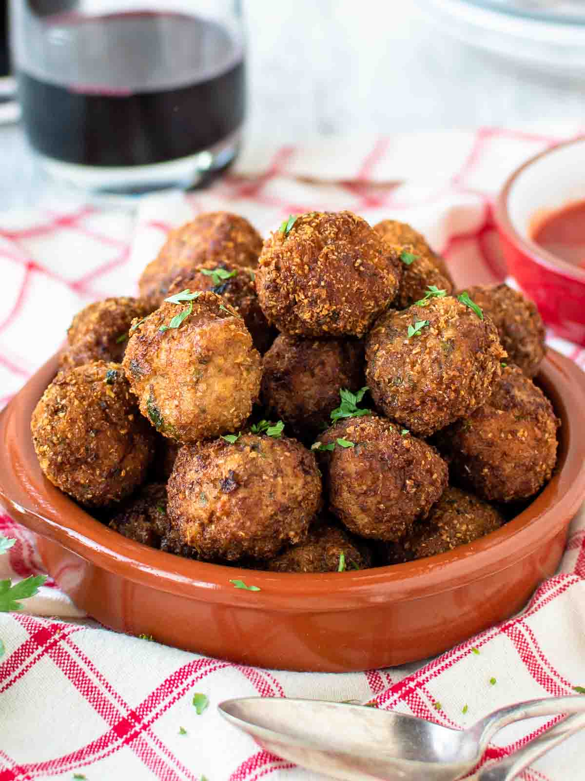 Fried Meatballs piled into a shallow terracotta bowl.