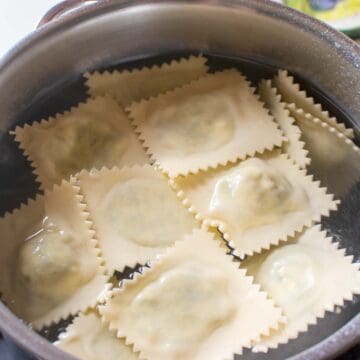 Ravioli being boiled in water.