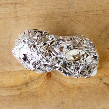 Scrunched oblong lump of aluminum foil.