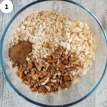 The dry ingredients for homemade granola in a bowl viewed from above.