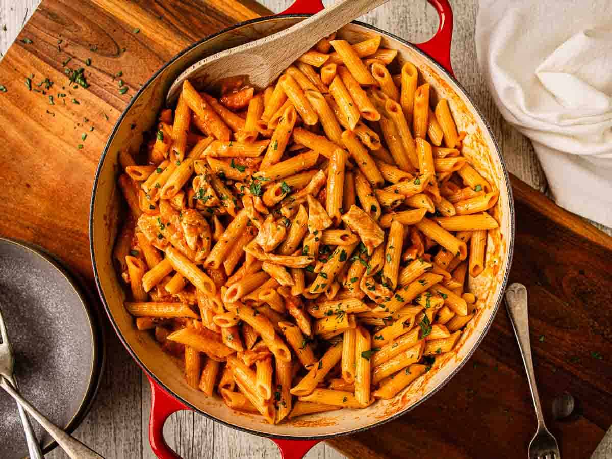 Penne pasta in creamy tomato sauce viewed from above.