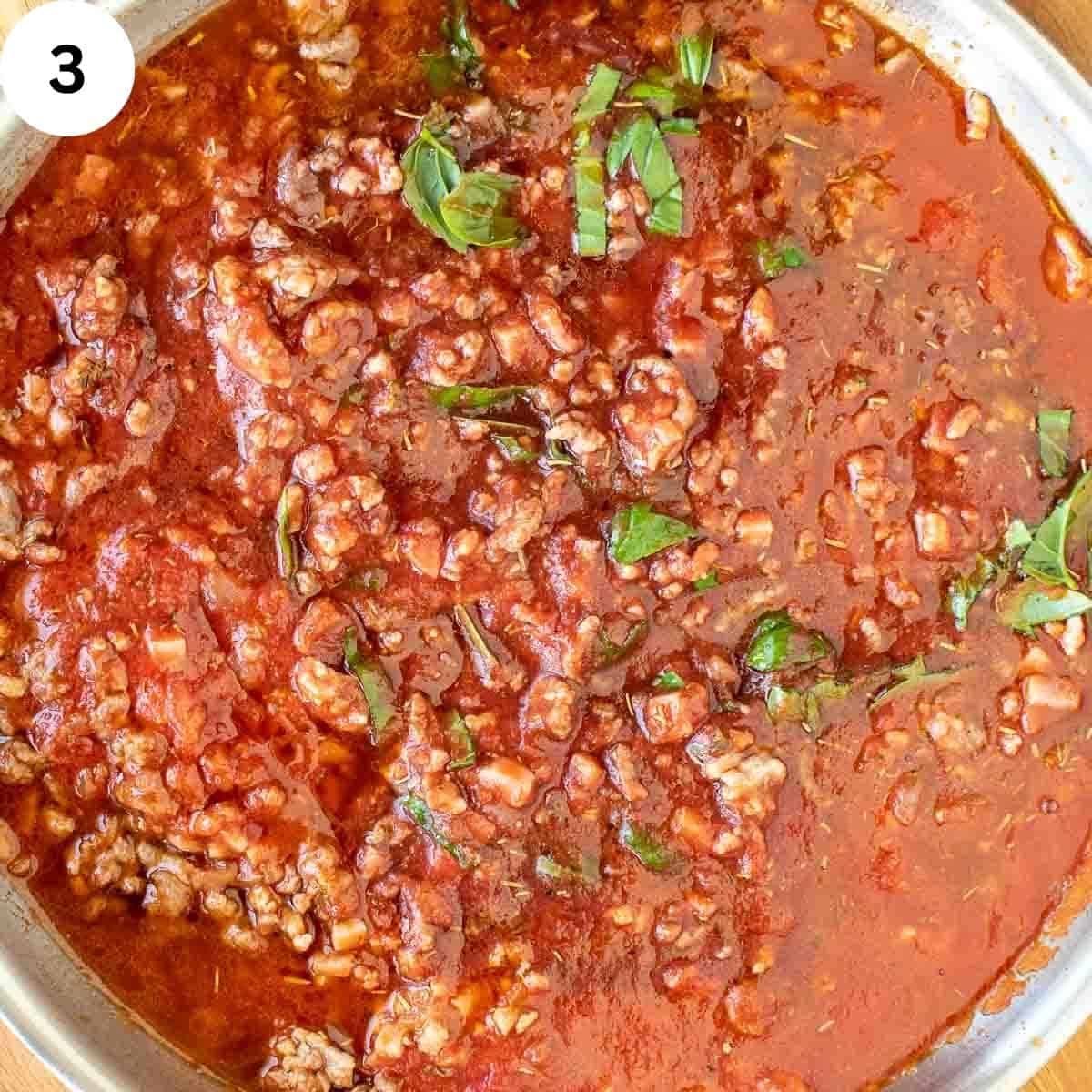 Meat sauce sprinkled with parsley viewed from above.