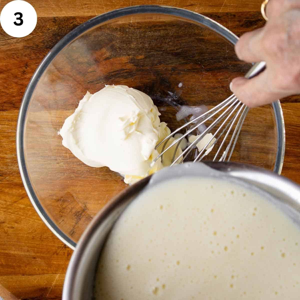 Pouring creamy liquid over thick white cream.