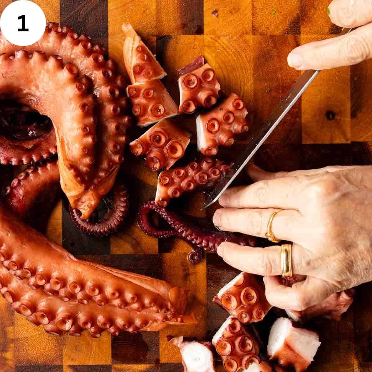 Cutting cooked octopus tentacles.