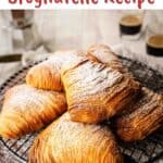 Flaky Sfogliatelle piled onto a round wire rack.