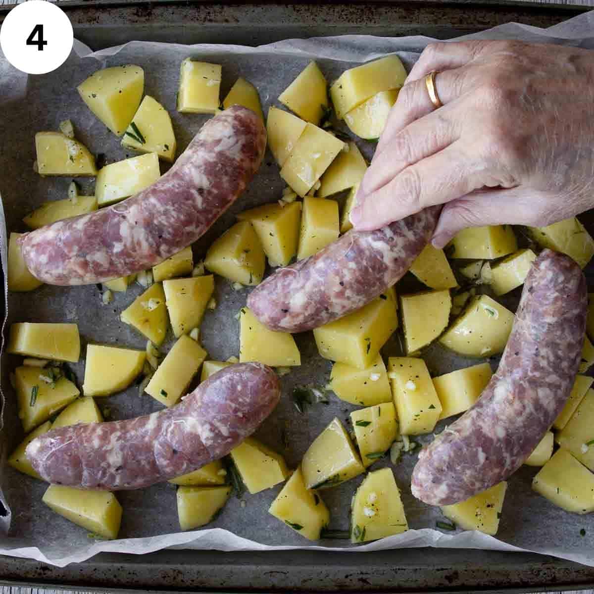 Place sausage links on cubed potatoes.
