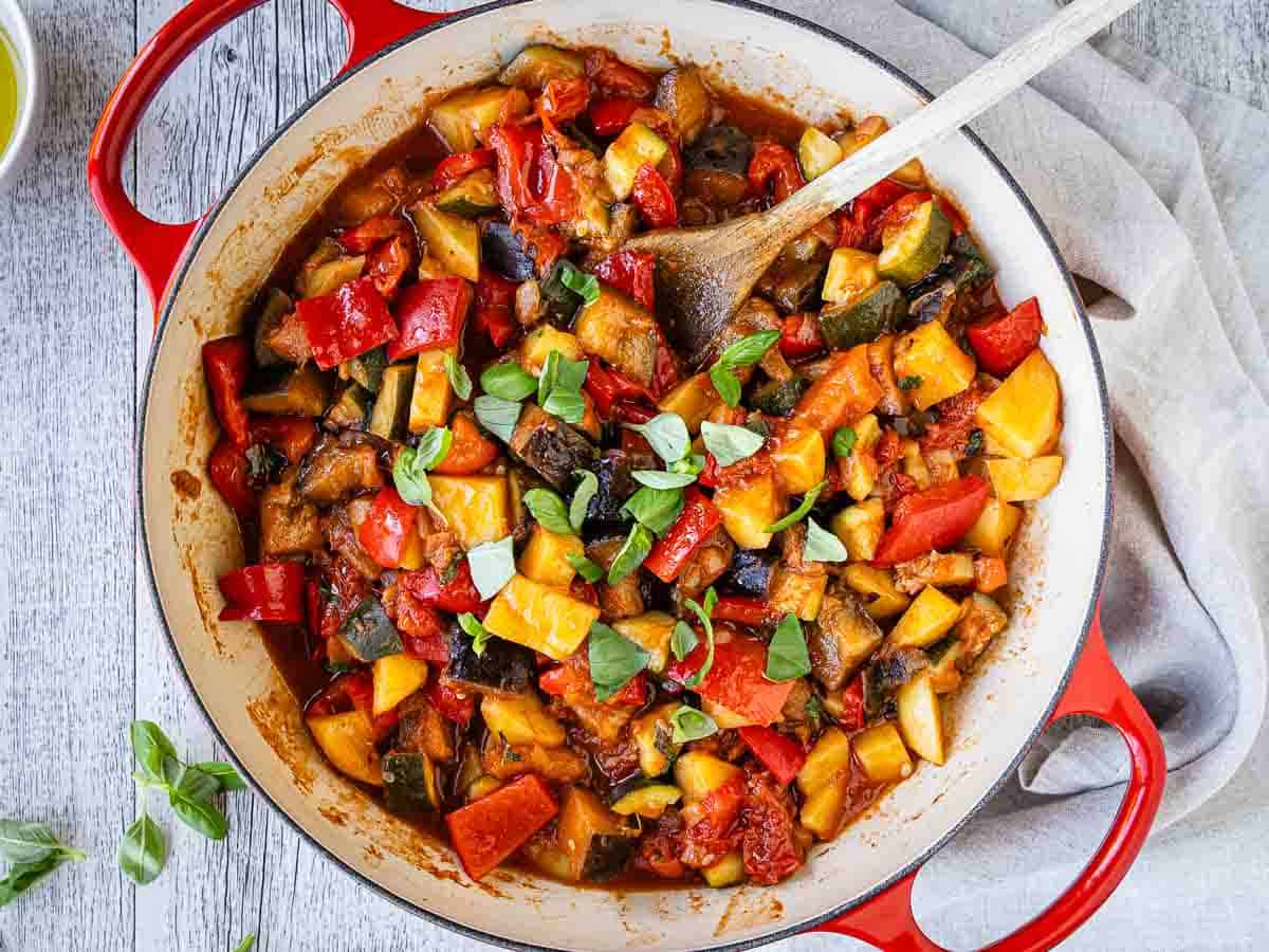 Italian vegetable stew in a round pan viewed from above.