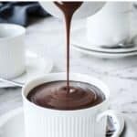 Italian Hot Chocolate being poured from a jug into a cup.