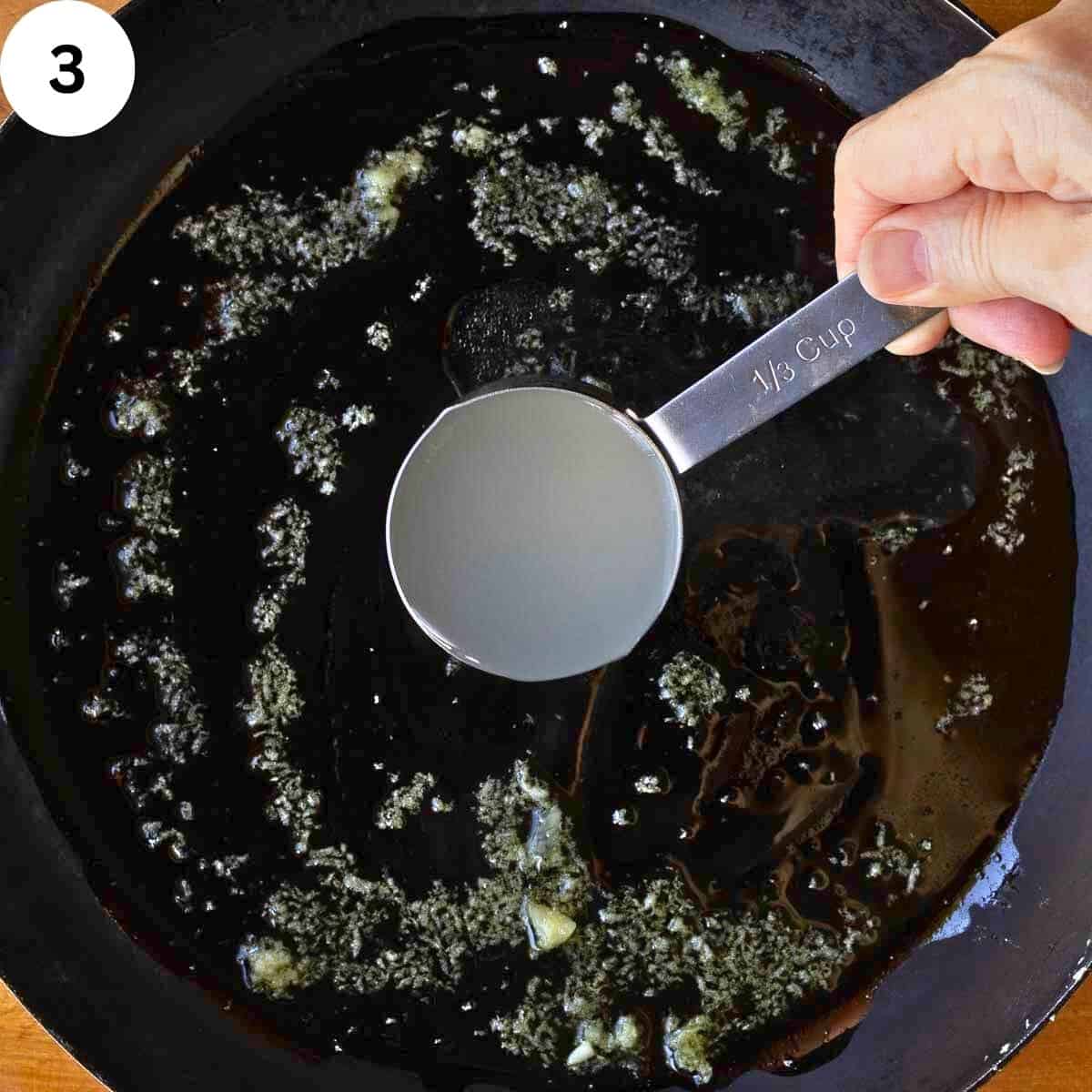 Starchy pasta water being added to a skillet.
