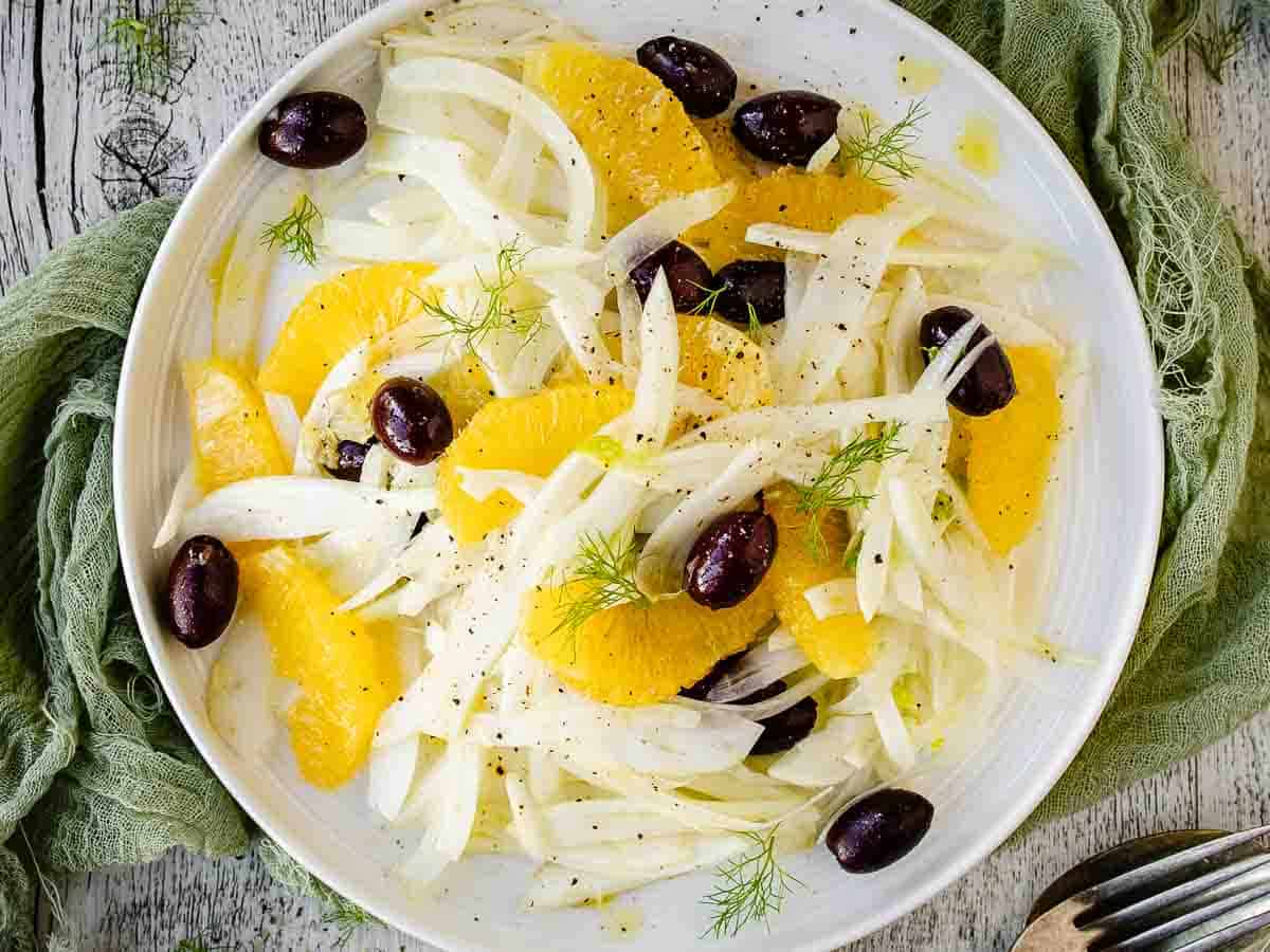 Overhead view of fennel salad with orange and olives.