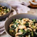 Beans and greens recipe prepared and served in a bowl.
