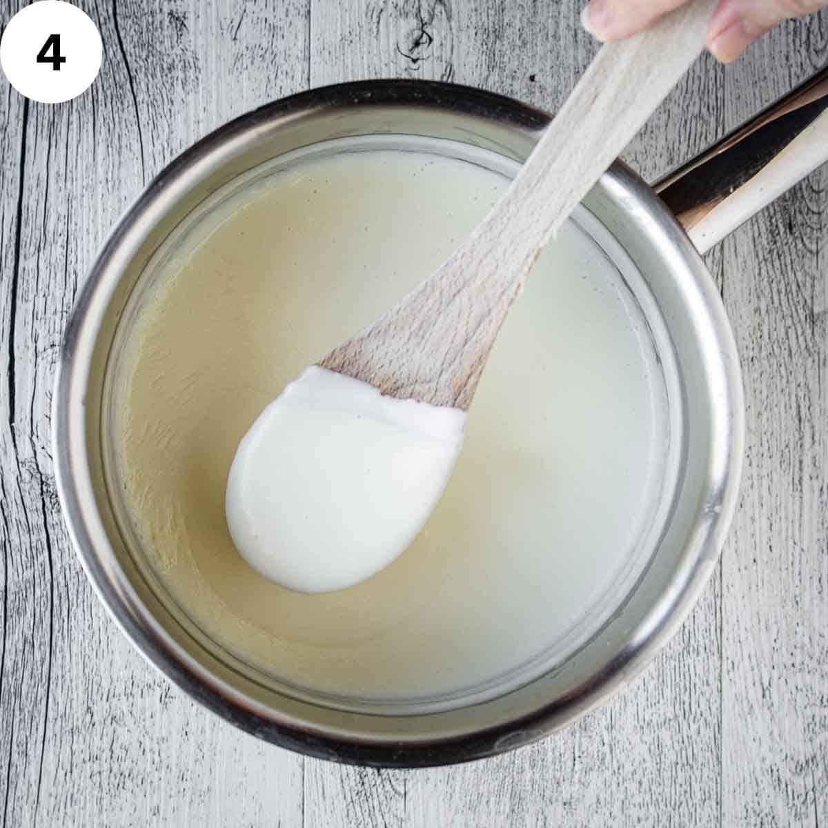 Stirring a white sauce.