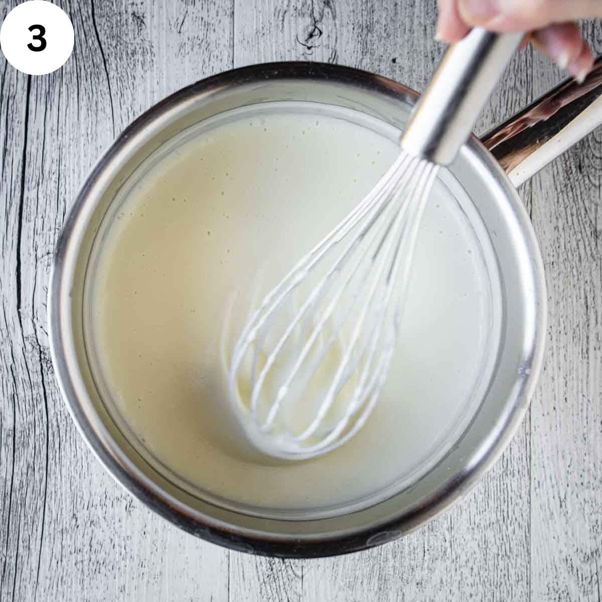 Whisking a white sauce.