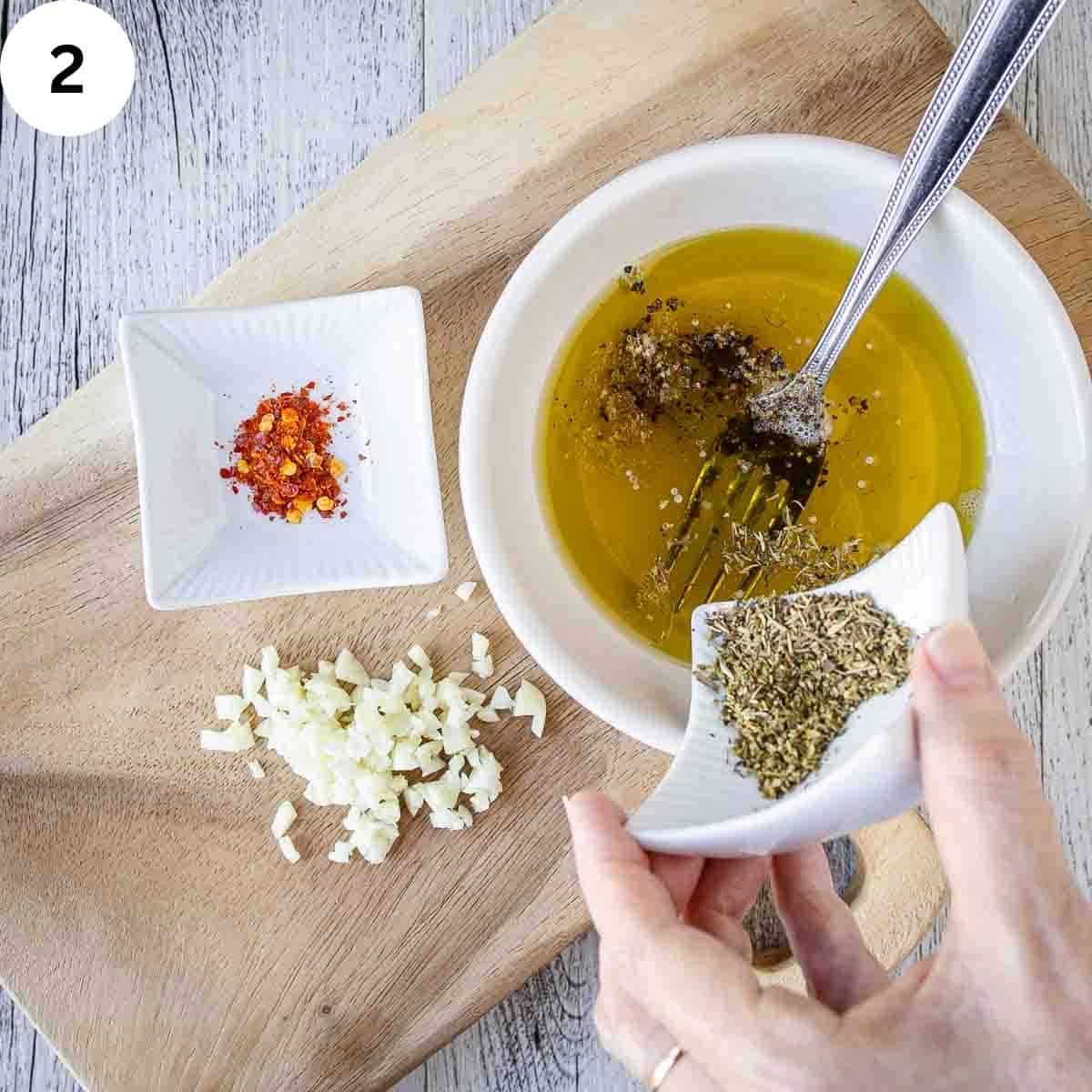 Mixing dressing for a salad.