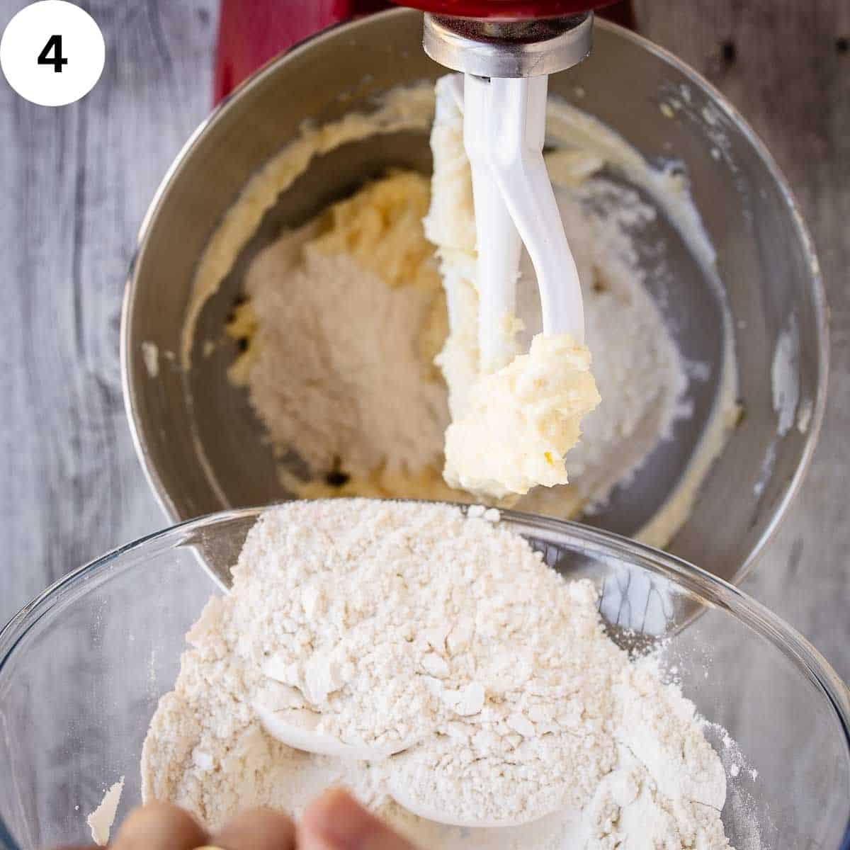 Adding flour to creamy mixture in a stand mixer.