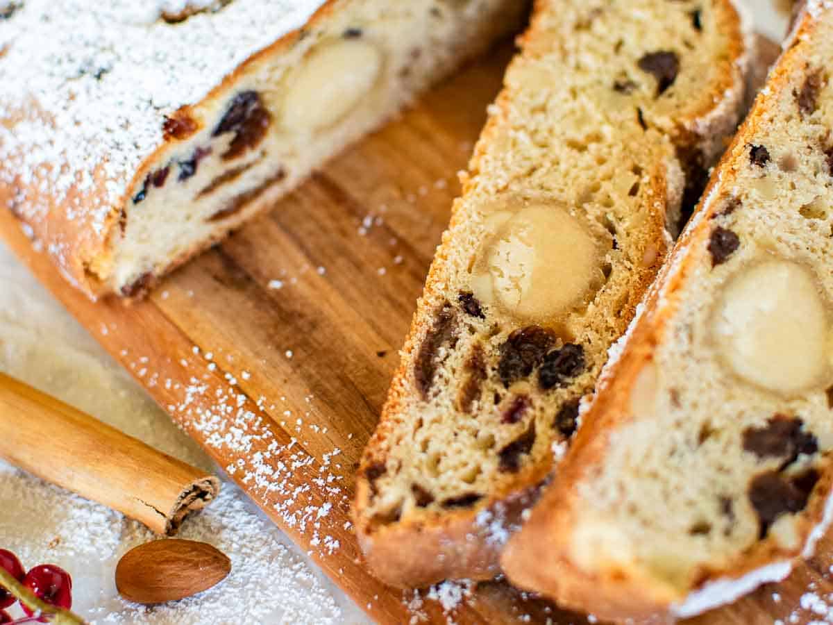 Close up of slices of bread studded with dried fruit.