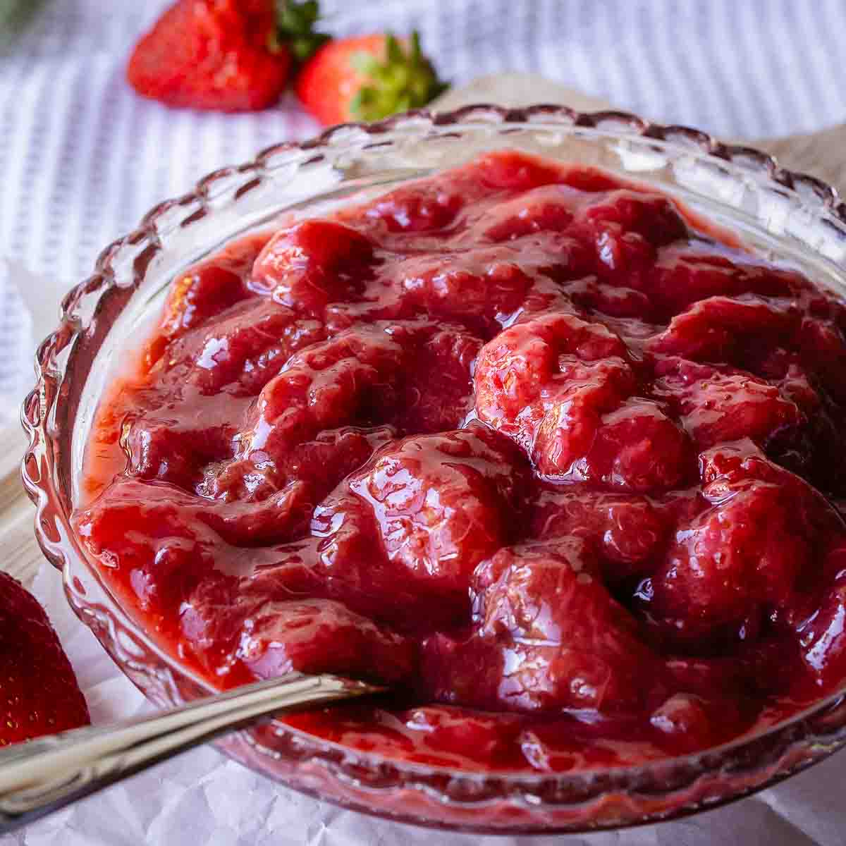 Strawberry rhubarb compote in a glass dish.