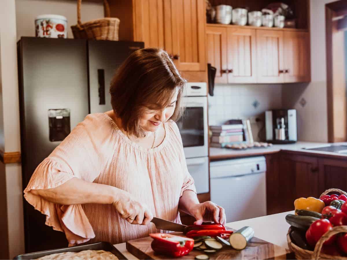 Woman cutting vegetables.