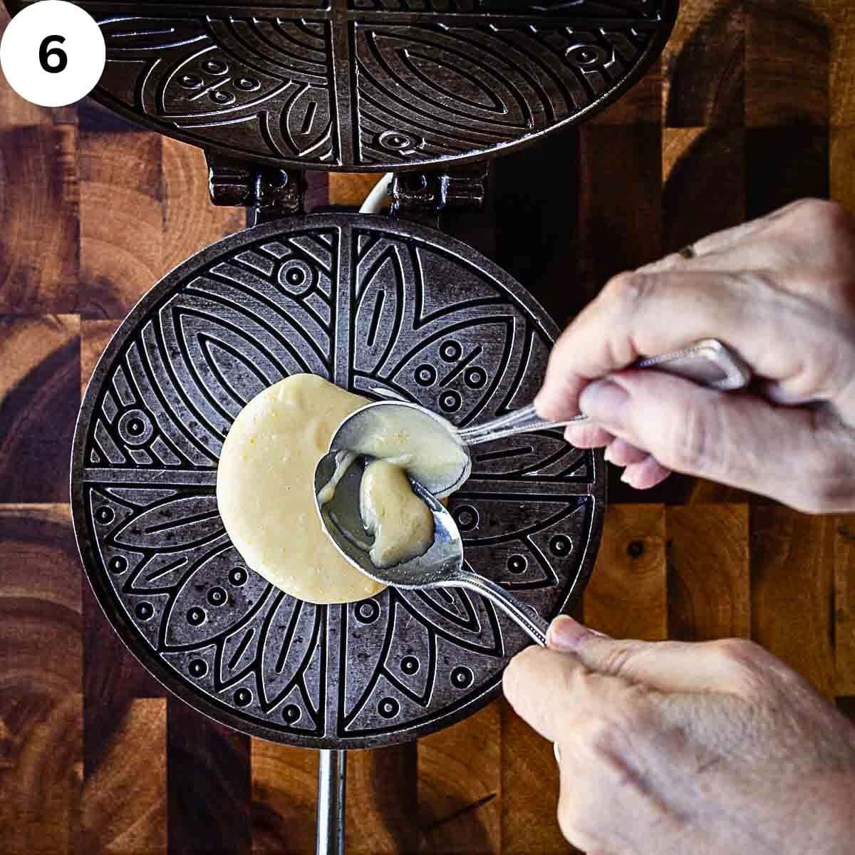 Dropping batter onto a waffle iron.