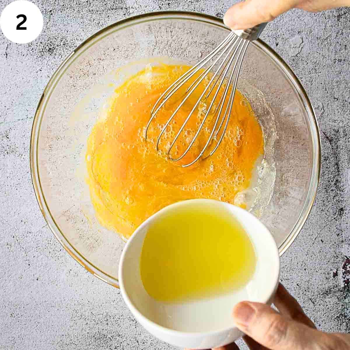 Adding oil to beaten eggs in a bowl.