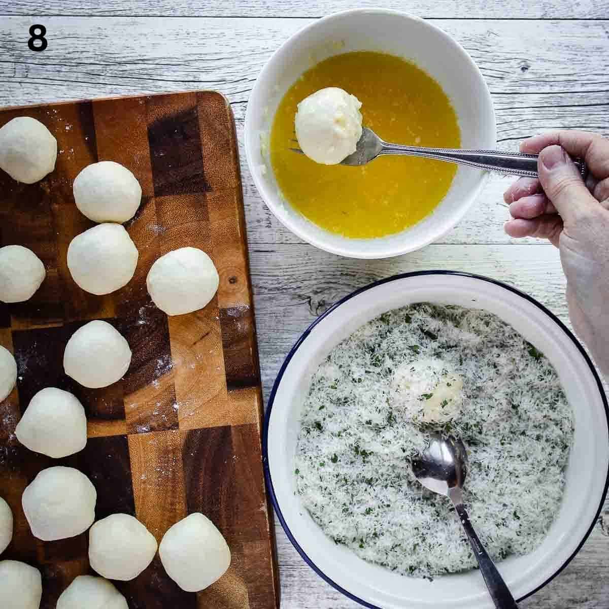 Dipping bread dough balls into melted butter.