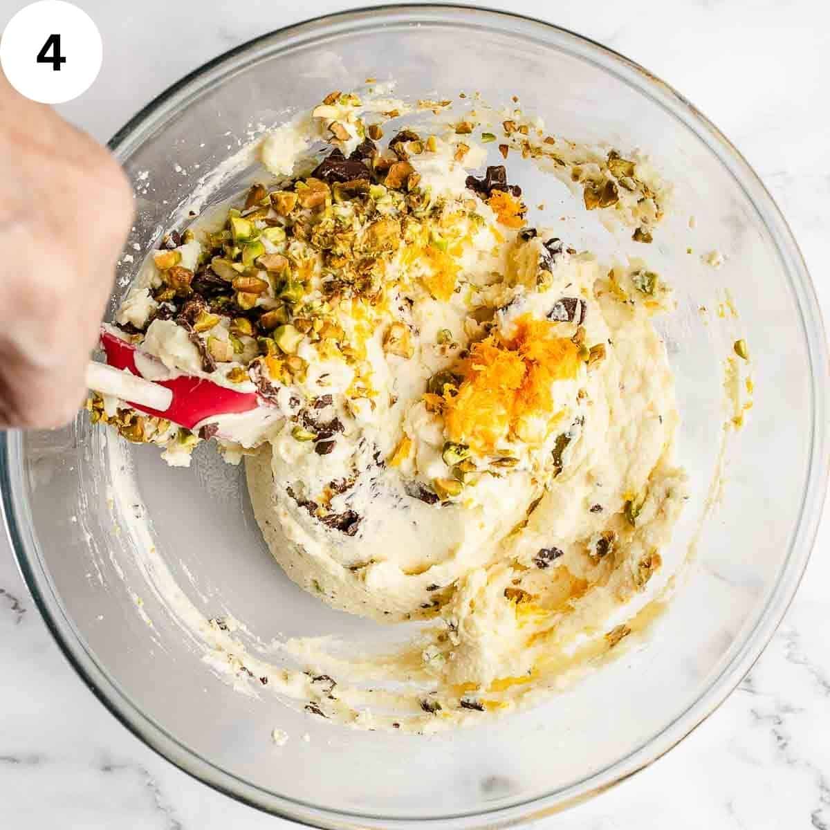 Stirring the remaining ingredients into the smooth ricotta mixture.